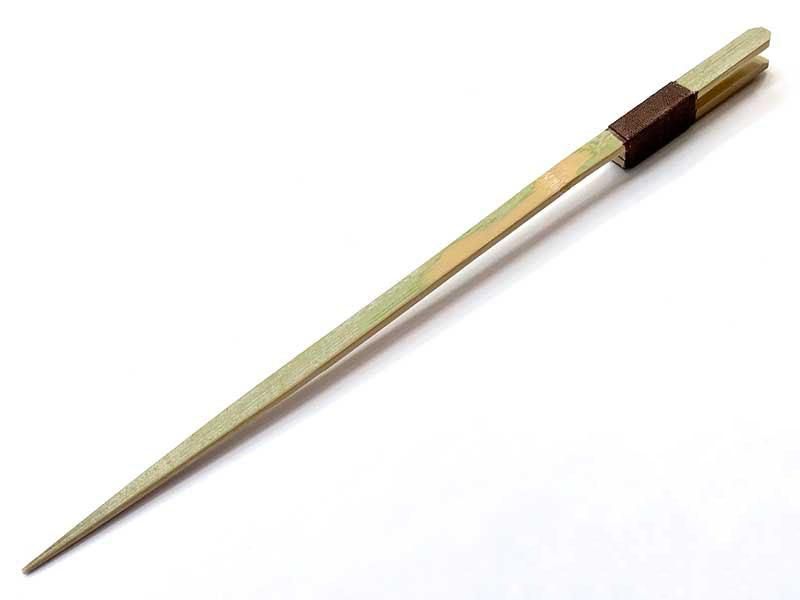 A single tapered bamboo kendo stick photographed on a white background.