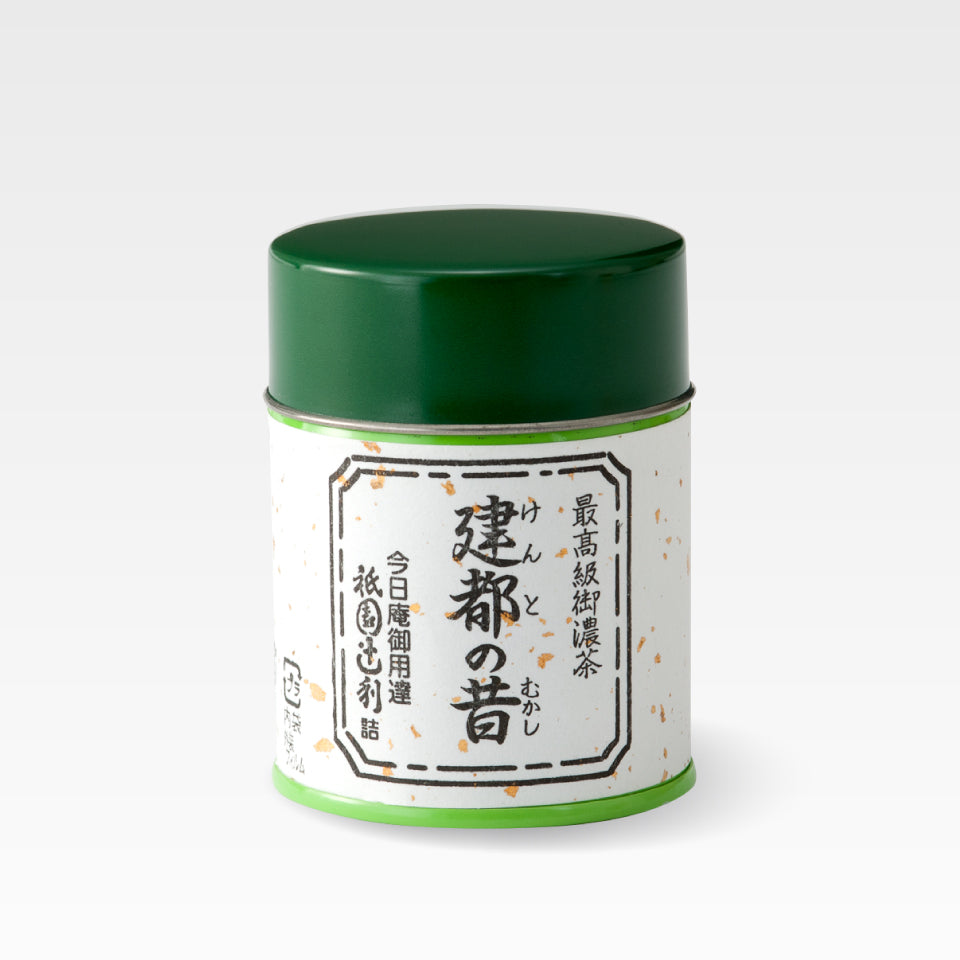 Green-lidded tin of matcha green tea with a Japanese label reading 建都の昔.
