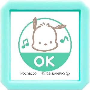Mint-green square plastic stamp showing a Pochacco character illustration with the word "OK" and two musical notes.