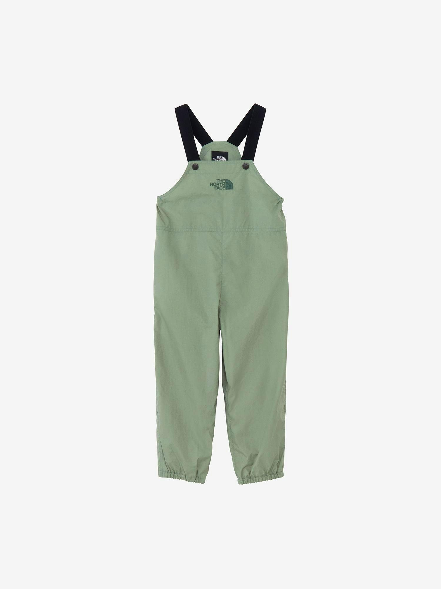 Front view of green children's bib pants with black shoulder straps on a white background.