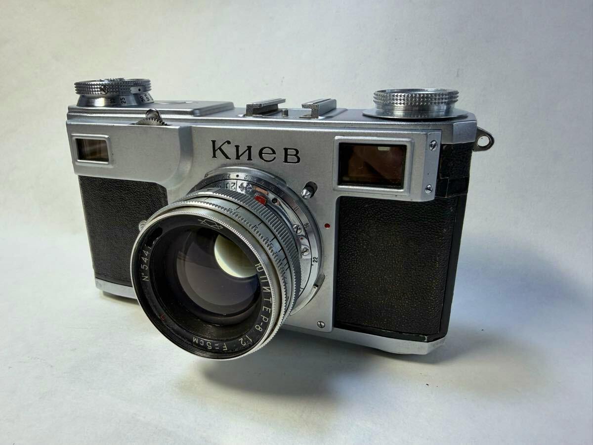Front three-quarter view of a Kiev 2 film camera with a Jupiter‑8 50mm f/2 lens attached.