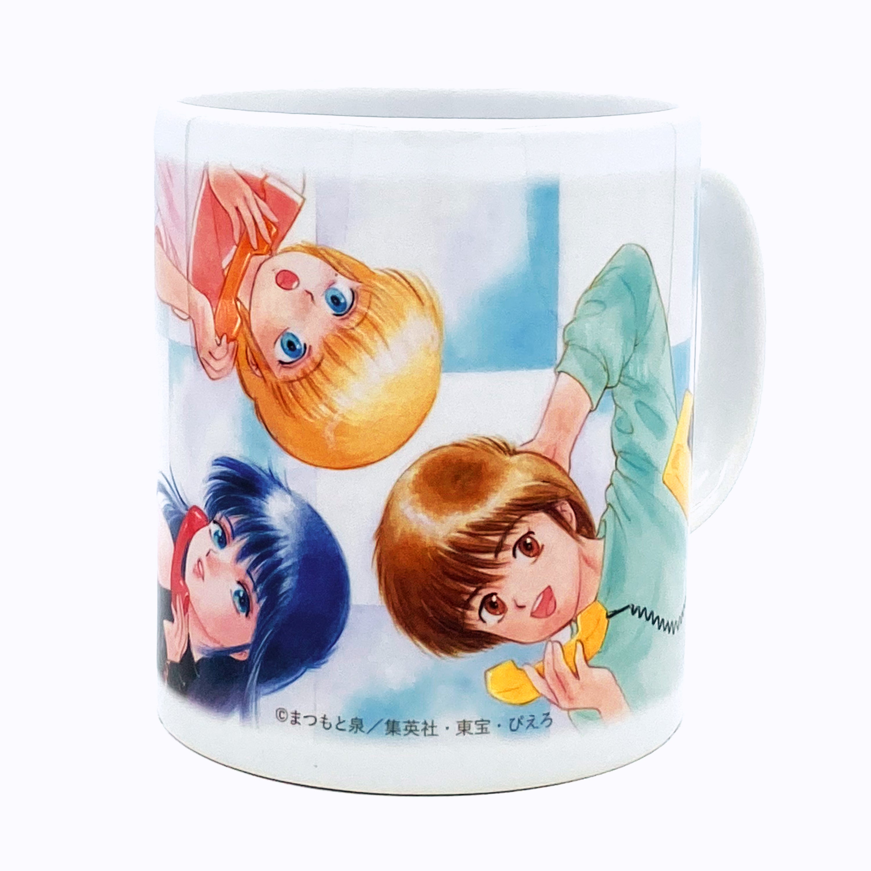 White ceramic mug printed with a colorful illustration of three characters from the anime "Kimagure Orange Road."