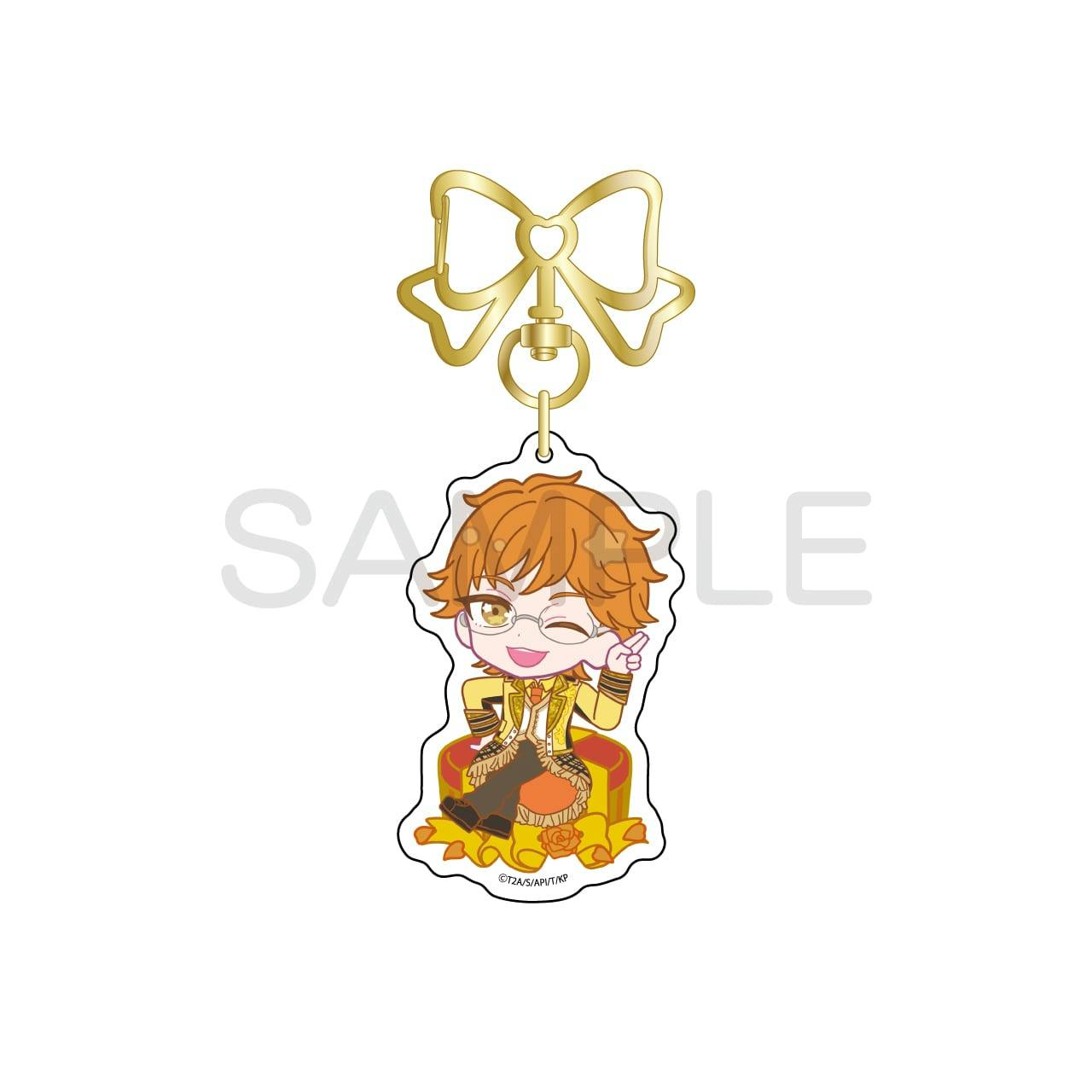 A chibi acrylic keychain of 十王院カケル (KING OF PRISM) with a gold bow-shaped clasp shown on a white background.