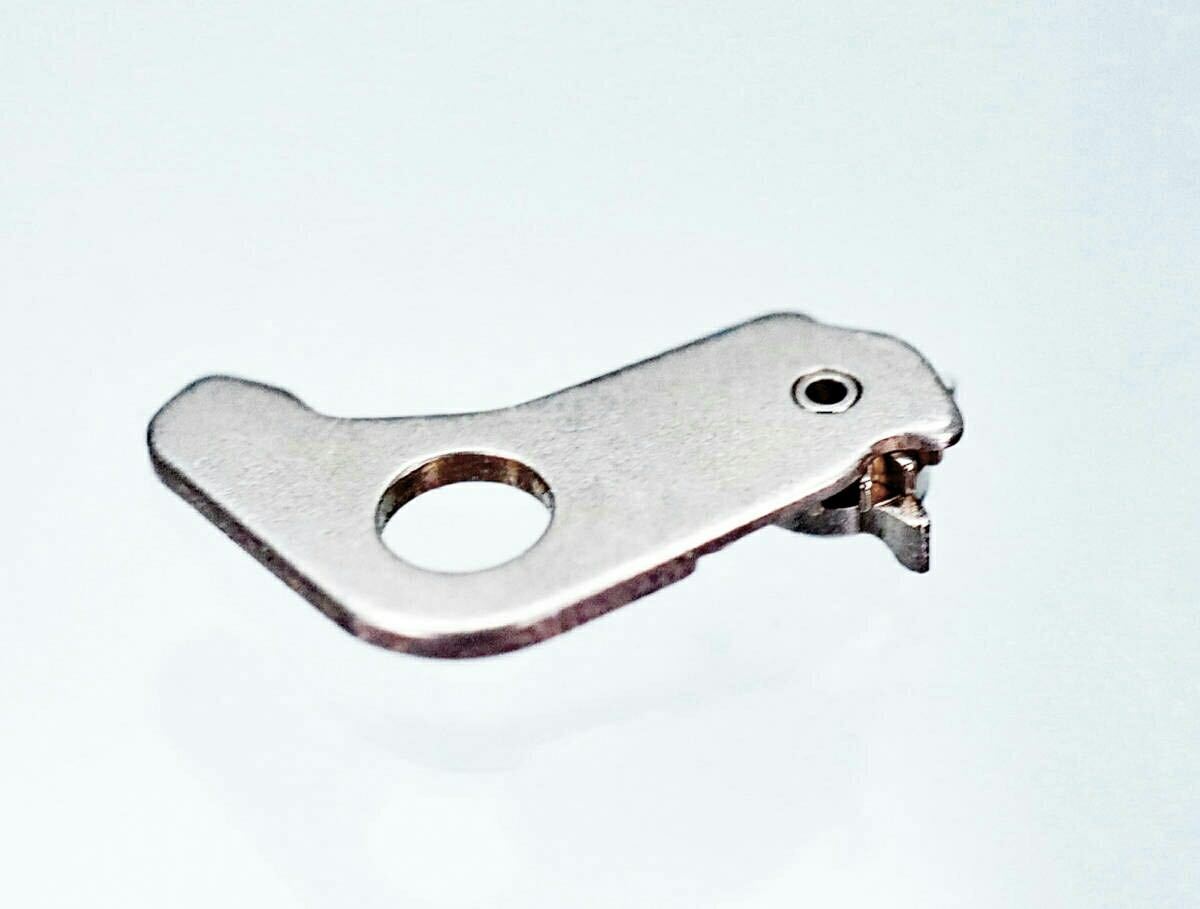 Metal calendar quickset lever (parts number 981560) for a Seiko watch shown on a white background.