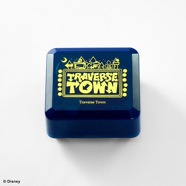 A blue Traverse Town music box with a yellow "TRAVERSE TOWN" graphic on the lid sitting on a white background.
