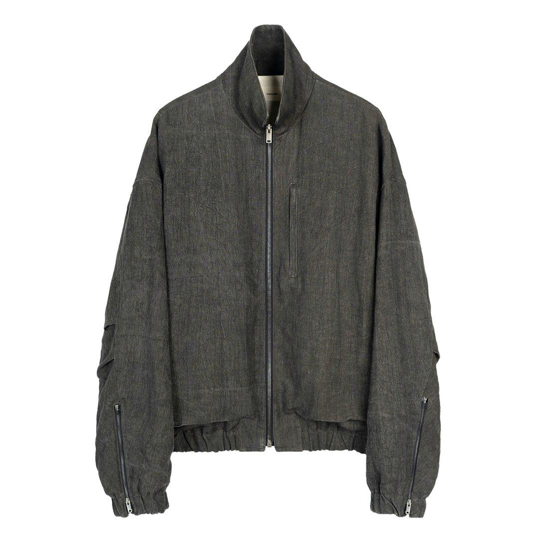 Front view of the Kira Drape Blouson in sumi-dyed linen showing zip front, high collar, and gathered hem.