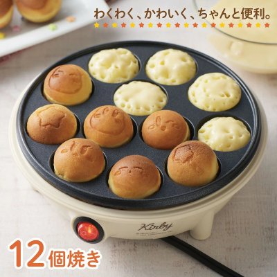 Electric takoyaki grill with a 12-cup cooking plate making small round cakes, several imprinted with Kirby faces.