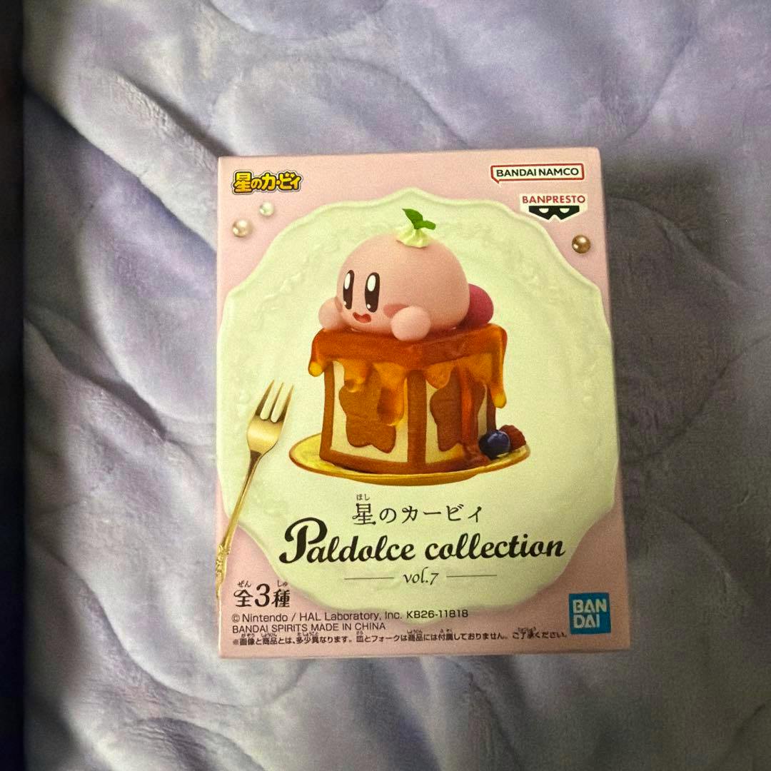 Front photo of the boxed, unopened 星のカービィ Paldolce collection vol.7 A plastic figure showing the product box with Kirby on honeyed toast artwork.
