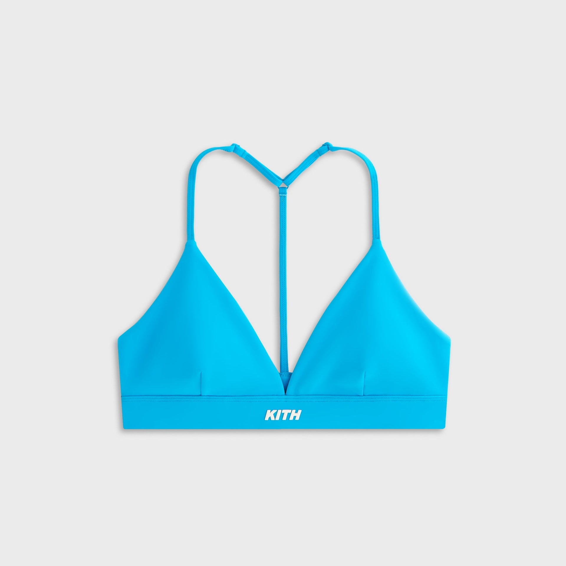 Front view of the Kith Women Enhance Teoni Triangle Bra in blue laid flat on a white background.
