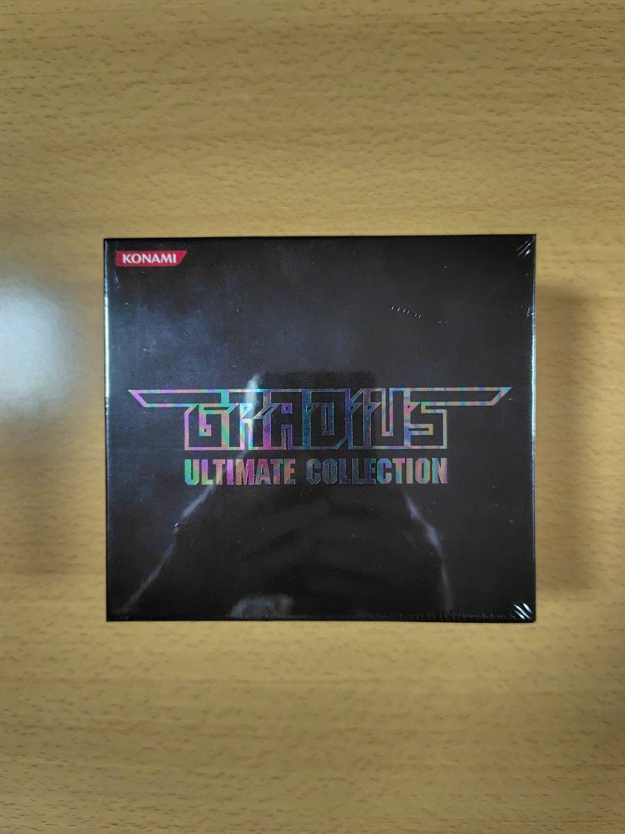 Sealed Gradius Ultimate Collection soundtrack CD box showing the front cover and KONAMI logo on a wooden surface.