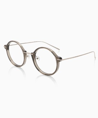 Konstantin Grcic TYPE LINK eyeglasses with round translucent plastic frames and thin metal temples on a white background.