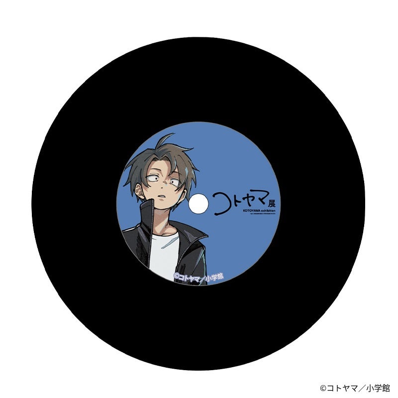 Black record-style plastic coaster with a blue center label showing the character Yomori Kou and the Kotoyama exhibition logo.