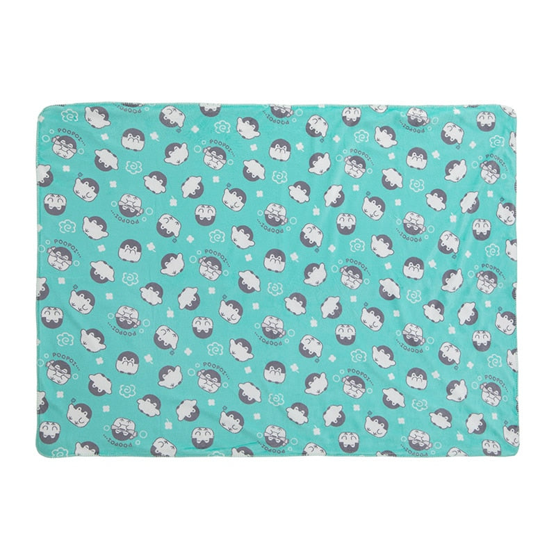 Turquoise Koupen-chan patterned polyester blanket laid flat on a white background.
