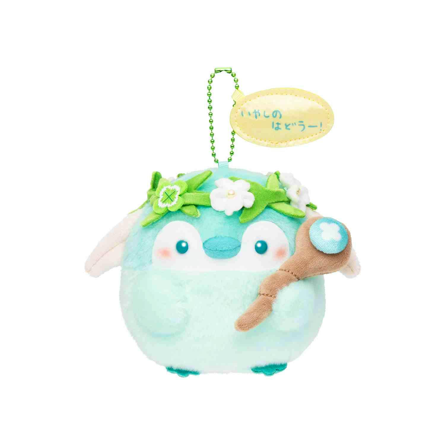 Close-up of the コウペンちゃん 君をおたすけパーティなマスコット（エルフ） plush keychain showing its face, flower crown, and attached ball chain.