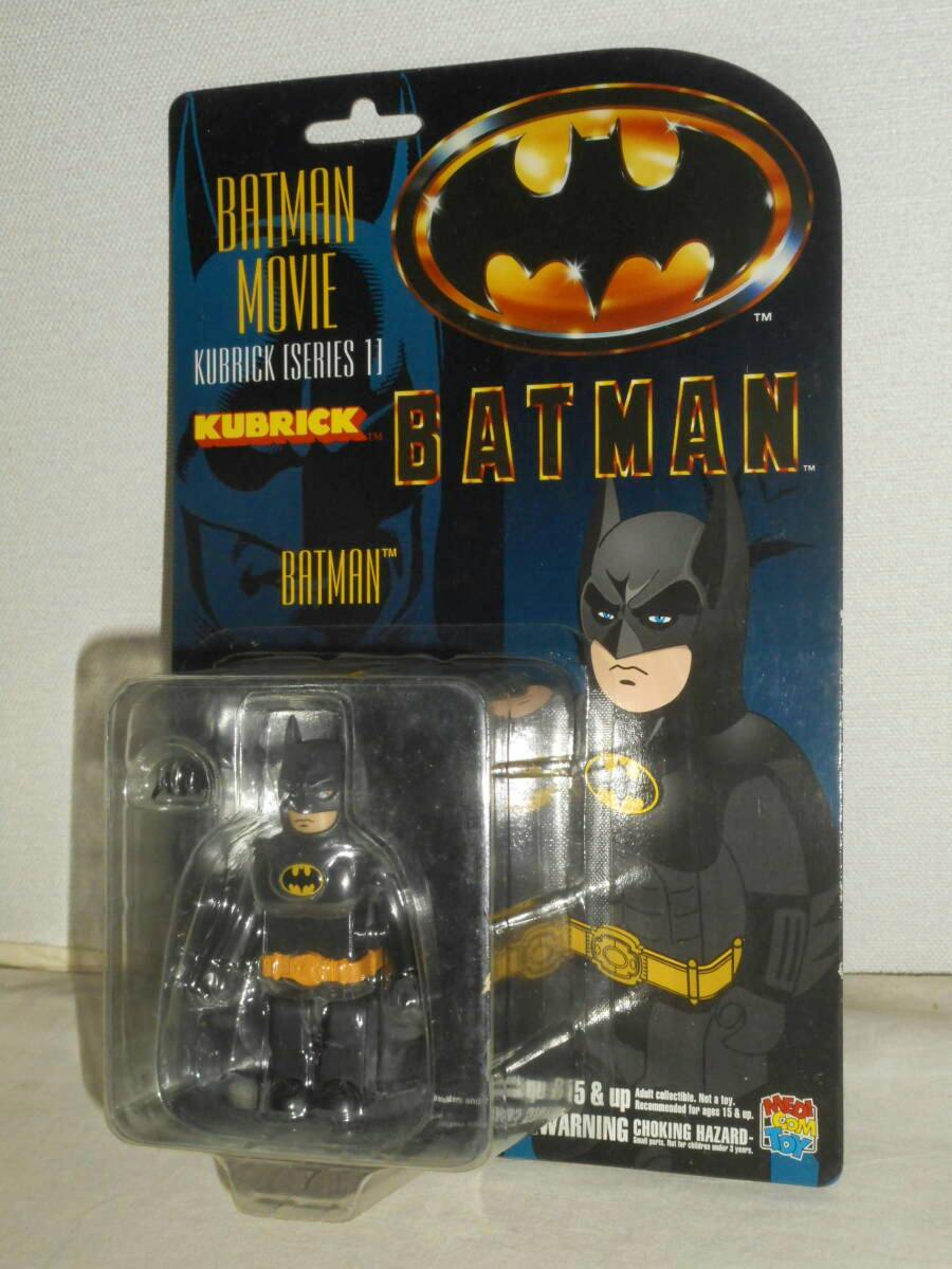 Packaged KUBRICK Batman Movie Series 1 plastic Batman figure shown in its blister card packaging with illustrated backing.