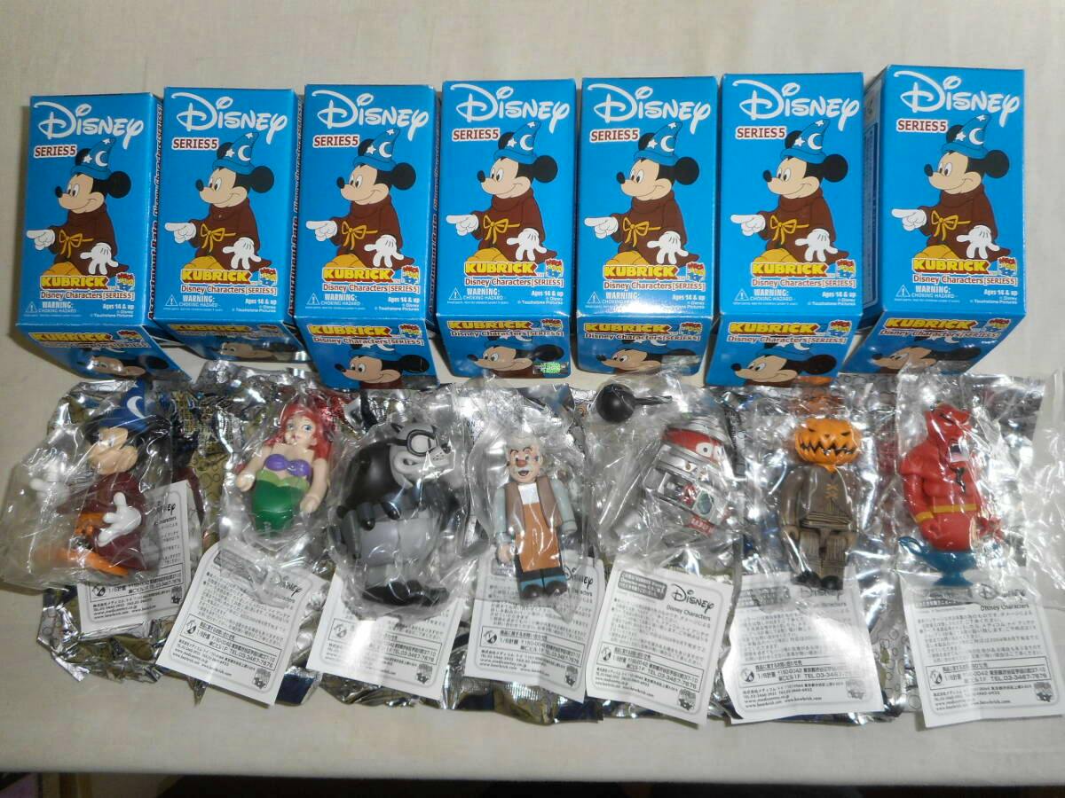 Seven KUBRICK Disney Characters Series 5 boxed figures with the seven sealed plastic-packaged figures displayed below them.