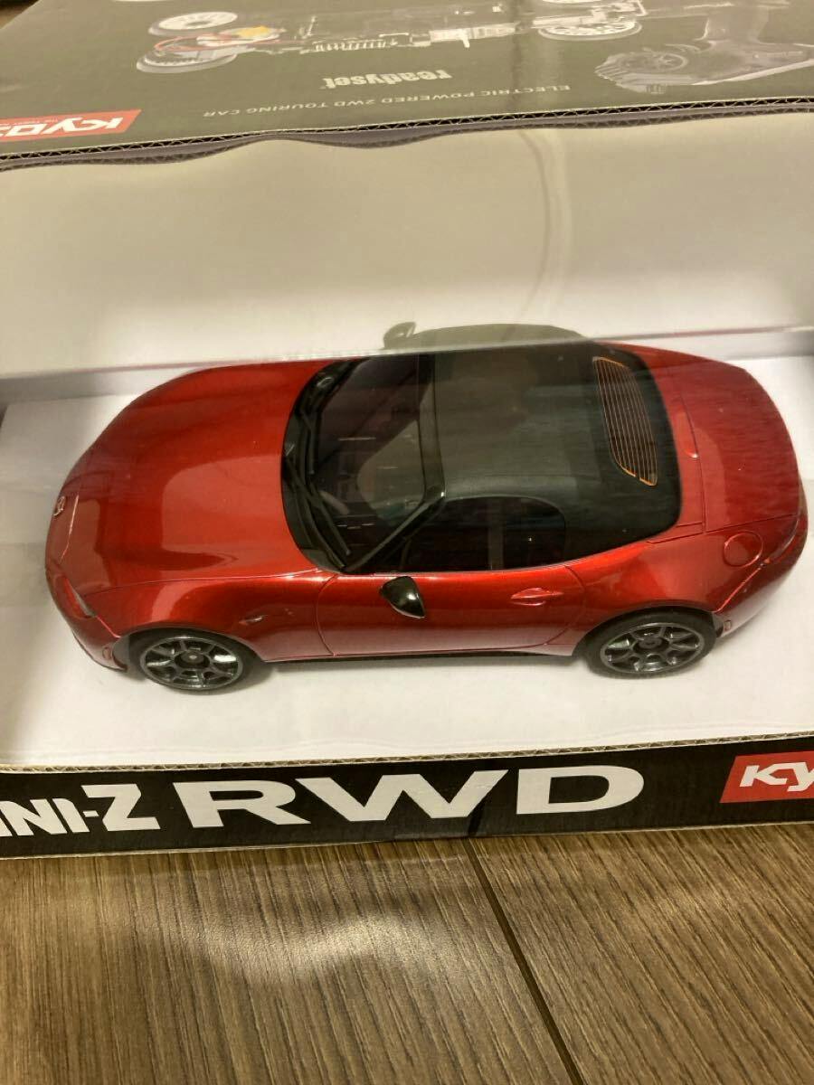 Top-down view of the red Kyosho Mini-Z RWD Mazda Roadster readyset radio control car displayed inside its retail box.