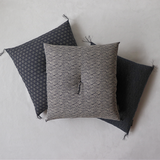 Three Kyoto zabuton cushions arranged overlapping on a light background showing aizome-fu patterns.
