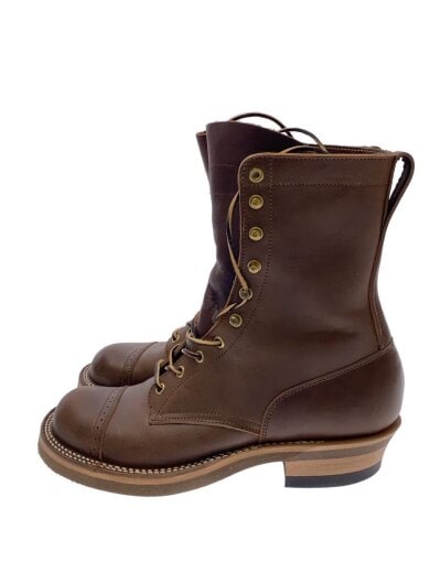 Side view of brown leather lace-up boots on a white background.