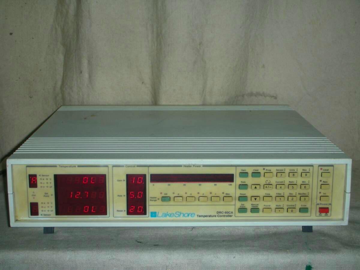 Front view of the Lake Shore DRC-93CA temperature controller showing its beige front panel with red LED displays and multiple control buttons.