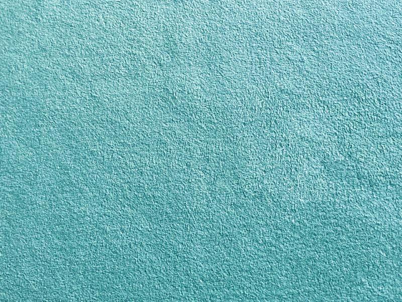 Close-up photo of light-blue suede-style polyester fabric showing its textured surface.