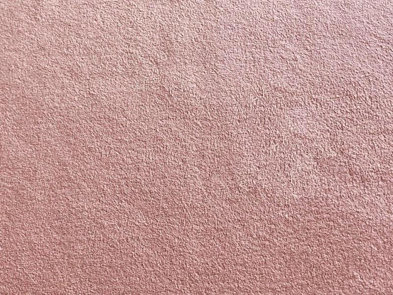 Close-up of the pink flame-retardant suede-like polyester fabric showing its textured nap.