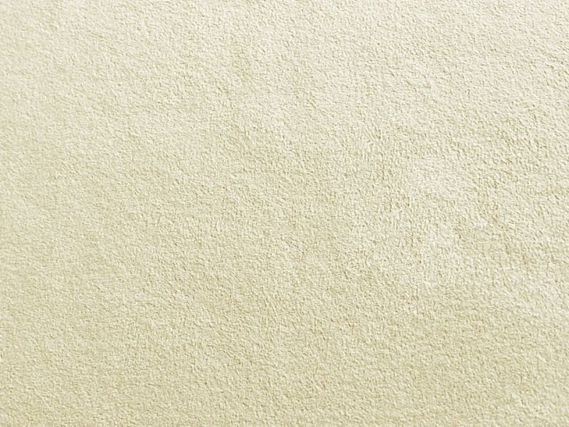 Close-up of ivory suede-style polyester fabric showing its textured surface.
