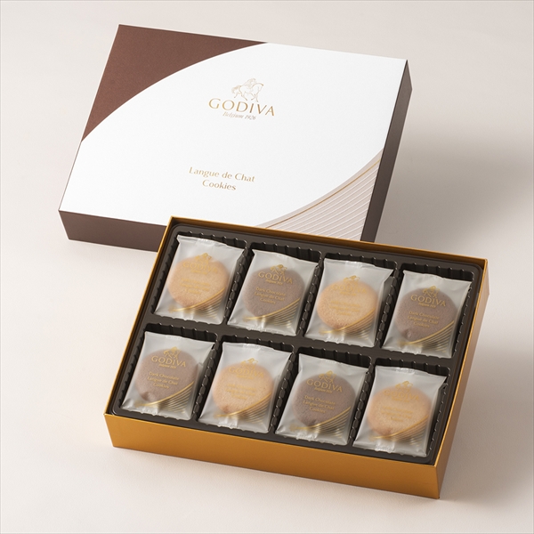 Opened box of the cookies with individually wrapped cookies arranged in a tray beside the box.