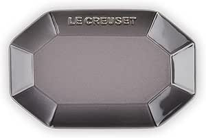 Top-down view of a flint-colored octagonal Le Creuset ceramic plate with embossed LE CREUSET logo.