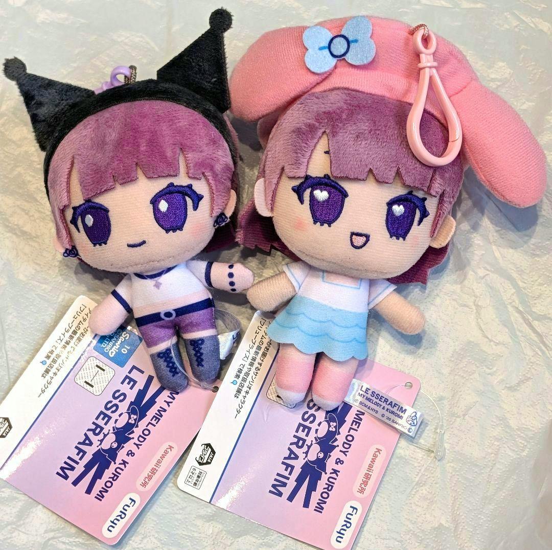Front view of two LE SSERAFIM plush keychain dolls (My Melody and Kuromi styles) with tags attached.