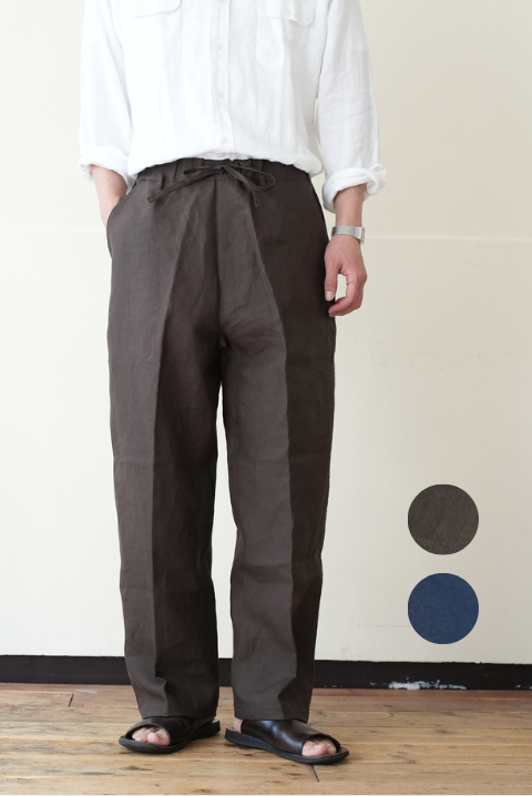 Front view of men's linen pants worn by a model with hands in pockets, two small color swatches shown at the bottom right.