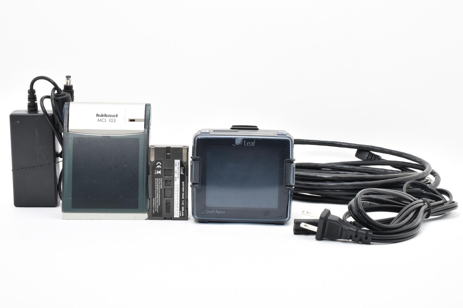 Leaf Aptus 75s digital back with charger, battery, and cables on a white background.