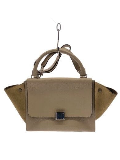 Front view of a beige leather handbag with top handles and flap closure.