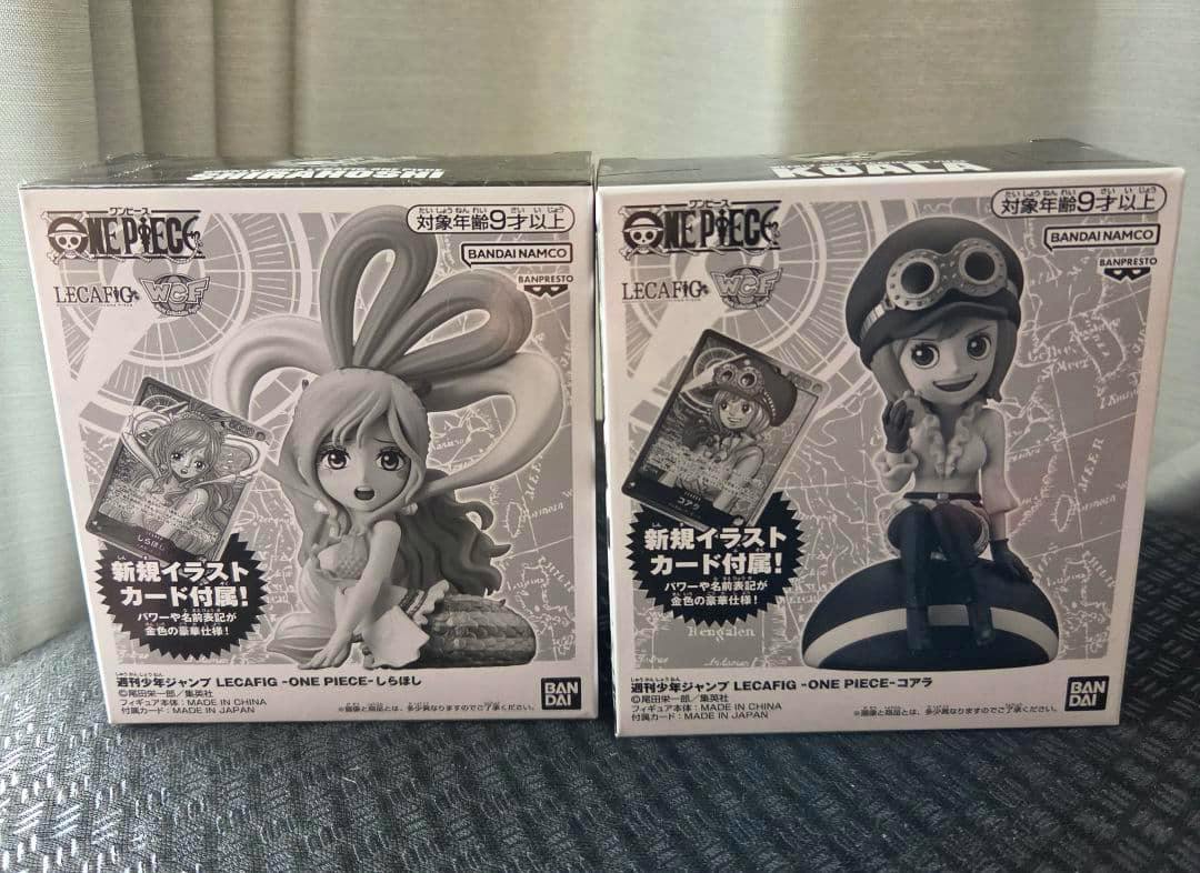 Front view of two boxed LECAFIG One Piece figure packages showing Koala and Shirahoshi.