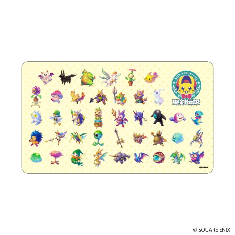 A rubber playmat printed with many small colorful monster illustrations and the 聖剣伝説 logo.