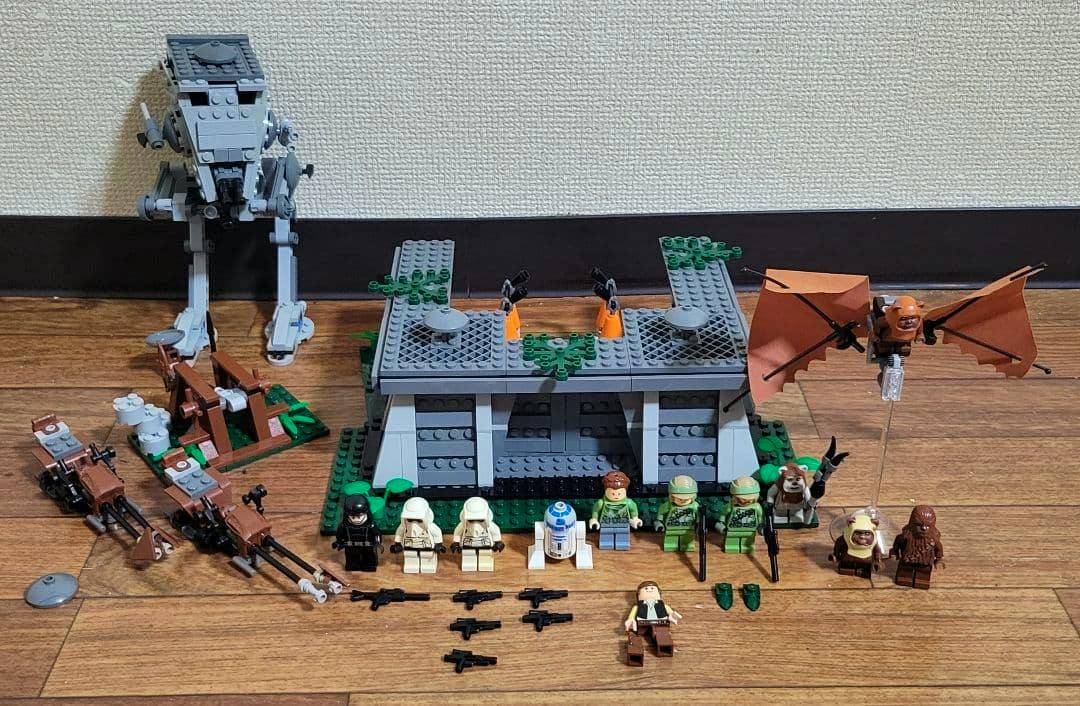 Assembled LEGO Star Wars 8038 Endor Battle set pieces and minifigures arranged on a wooden floor.