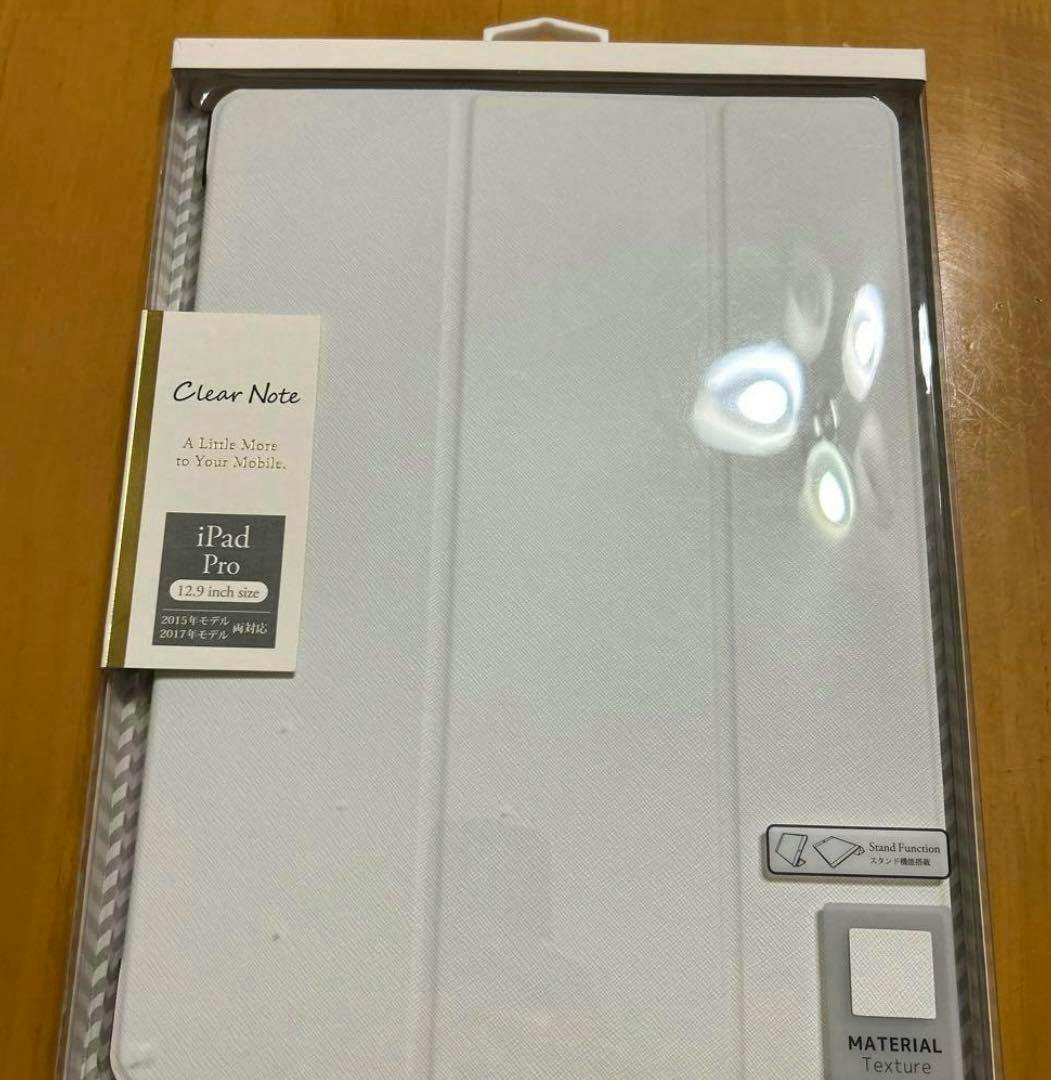 White iPad Pro 12.9-inch case shown inside clear retail packaging with cover visible.