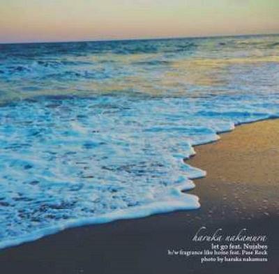 Album cover art showing a beach shoreline with waves and small white text in the lower-right corner.