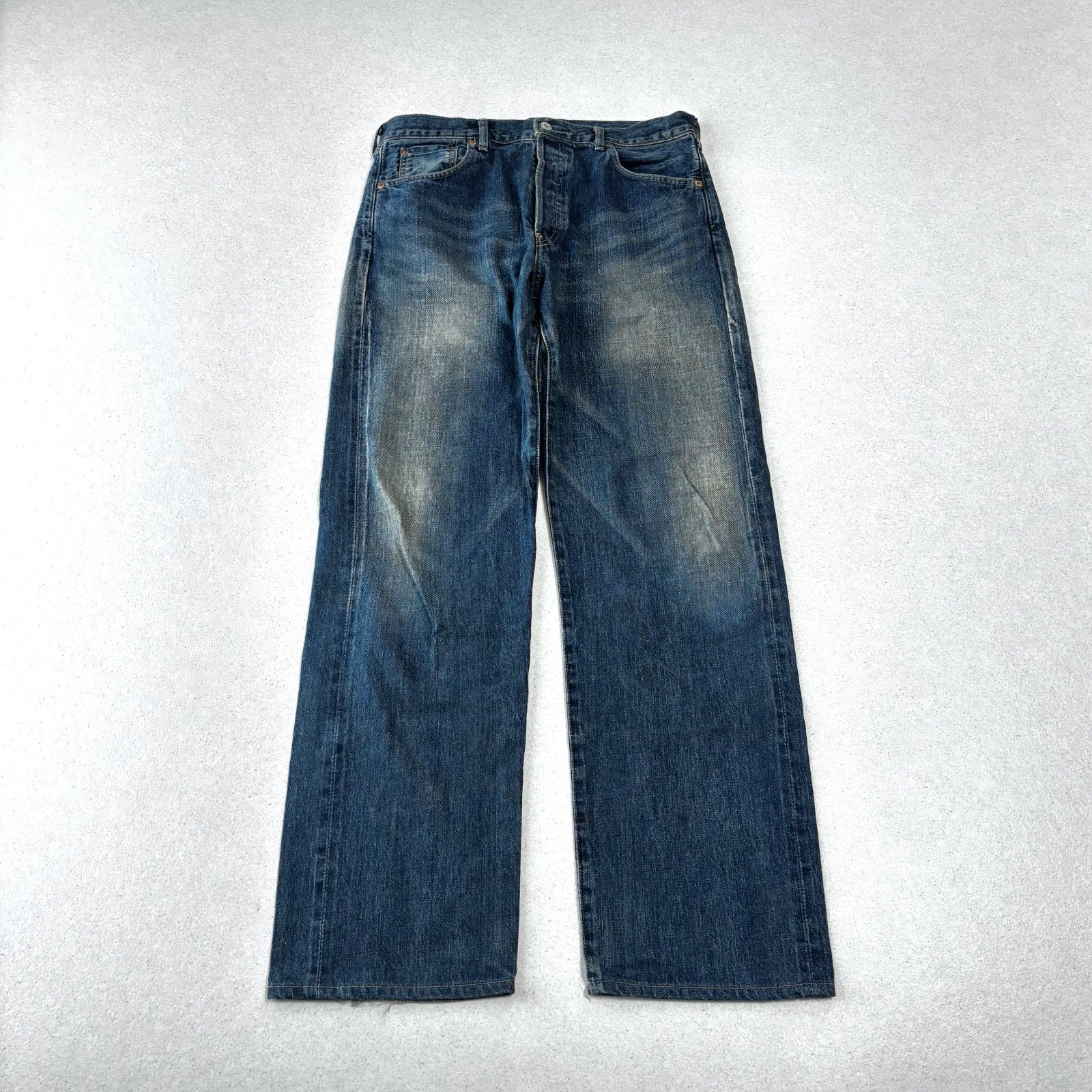 Levi's 702XX men's blue denim jeans laid flat showing the front view.