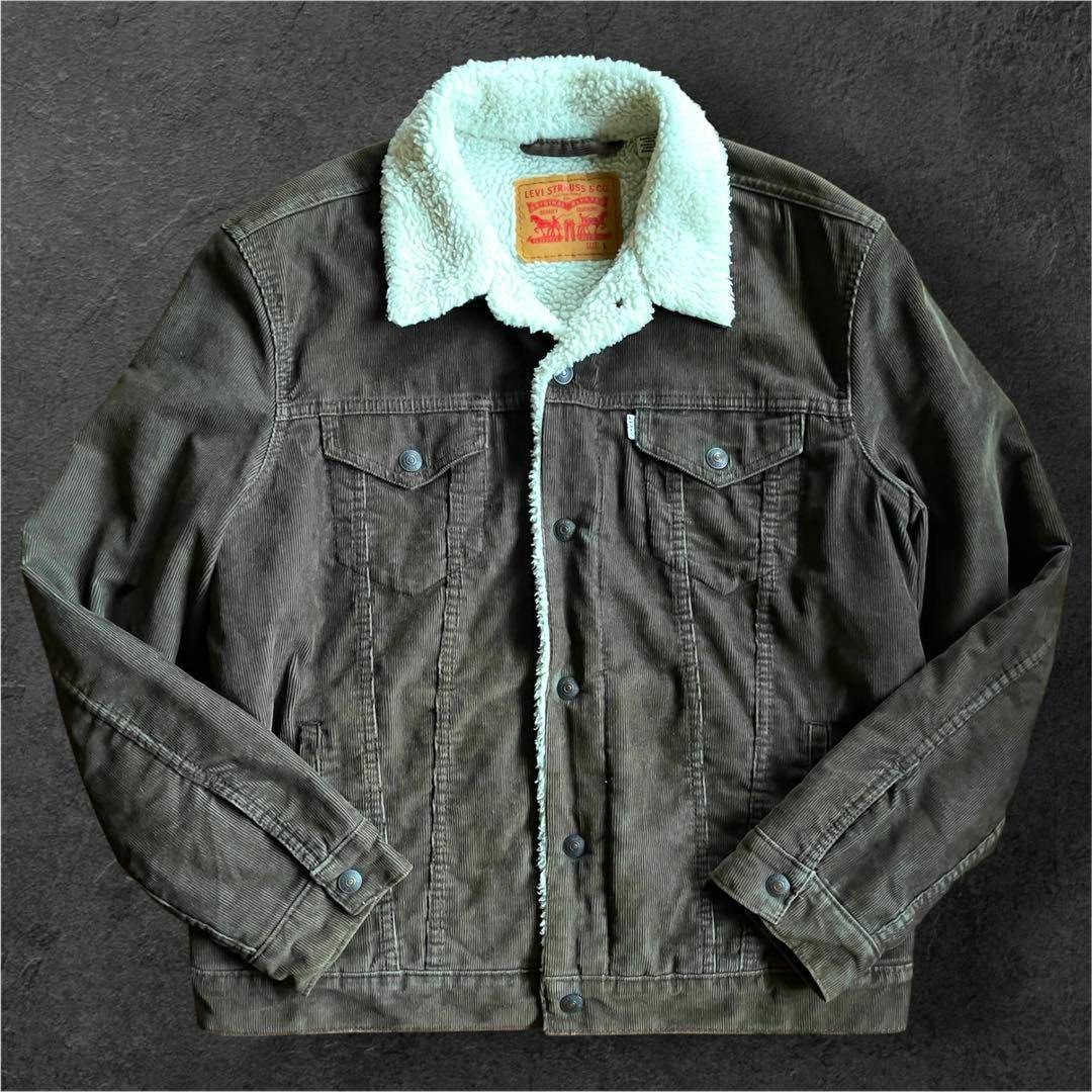 Brown Levi's corduroy sherpa-lined trucker jacket laid flat showing front, collar, and button closure.