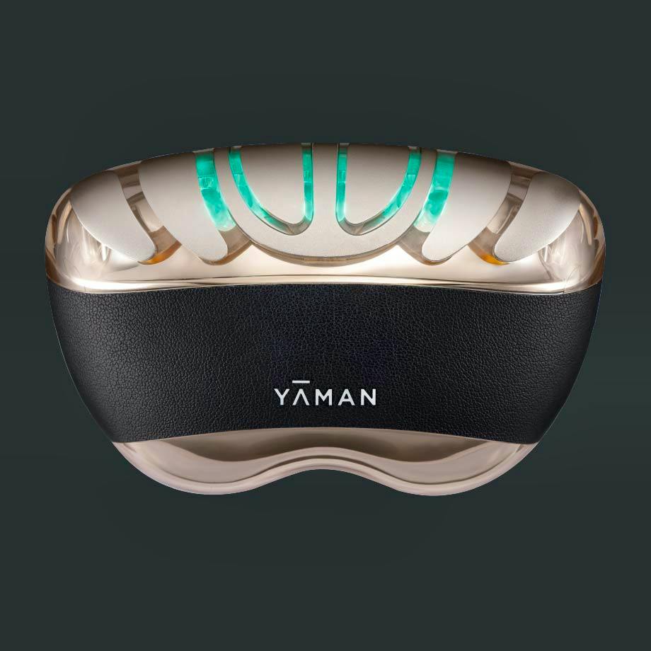Front view of the リフトロジー プロ device showing the YAMAN logo and green illuminated lights.