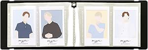 Open Lihit Lab myfa mini photo album in jet black showing four instant-photo sleeves with sample instant photos inserted.