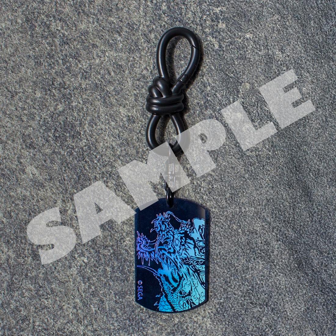 Aurora acrylic keychain featuring Kiryu Kazuma dragon artwork photographed on a dark textured background.