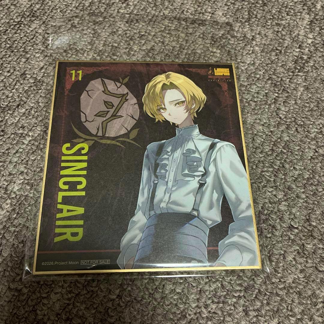 Photo of the picture board (shikishi) showing the character Sinclair with the name "SINCLAIR" printed along the left.