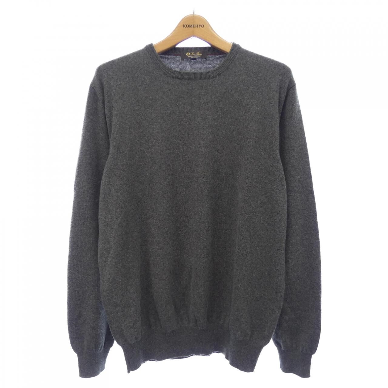 Gray Loro Piana cashmere knit sweater (FAB6916) hanging on a wooden hanger, shown front-facing.