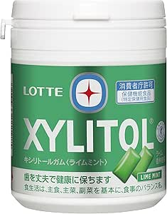 White plastic family bottle of Lotte Xylitol gum with a green Lime Mint label.