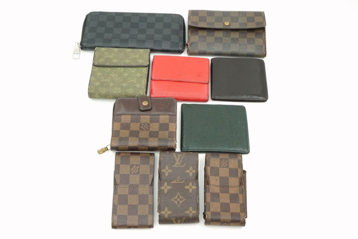 Ten Louis Vuitton wallets and small leather goods in various monogram and Damier patterns arranged on a white background.