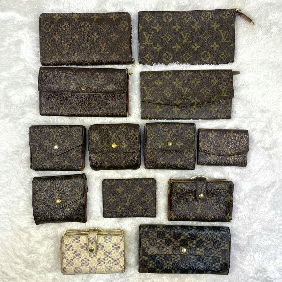 Thirteen Louis Vuitton wallets and small leather goods arranged on a white textured surface, showing monogram and check patterns.