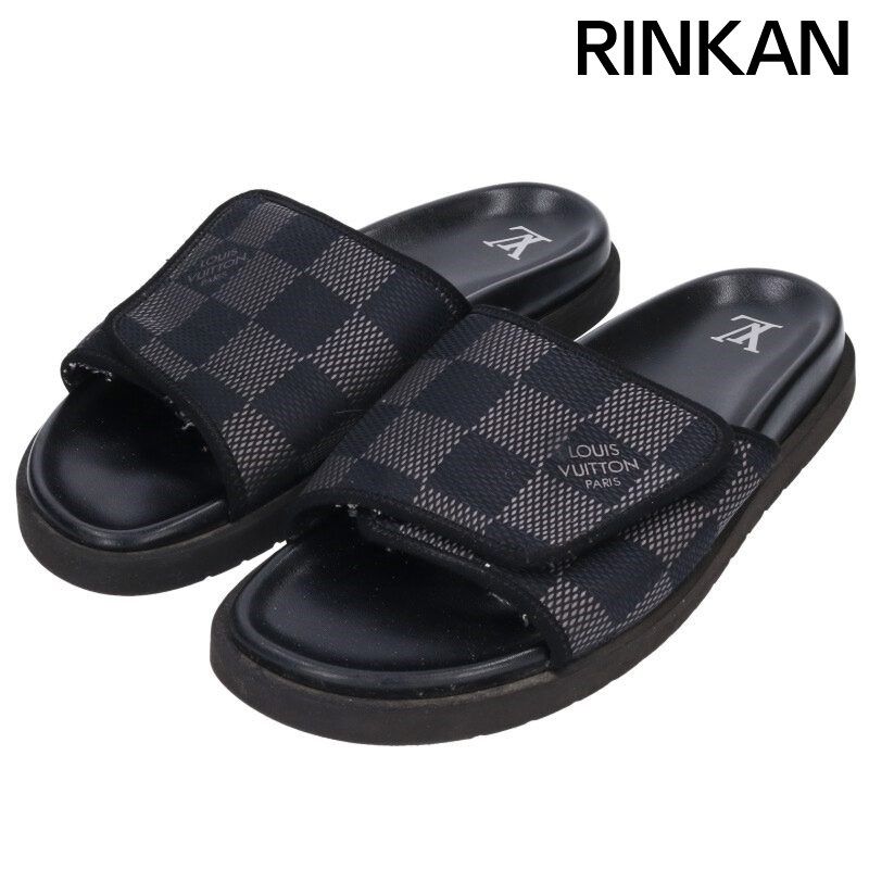Pair of men's Louis Vuitton black Damier-pattern rubber-sole leather slide sandals.