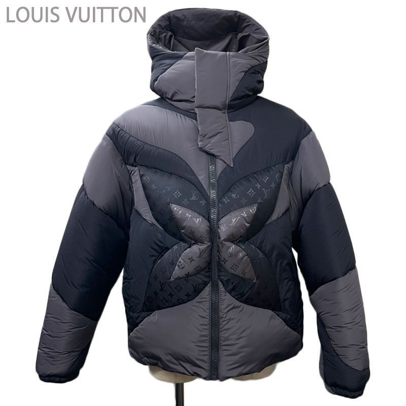Front view of a men’s Louis Vuitton black and gray monogram flower hooded puffer jacket (nylon) on a mannequin.